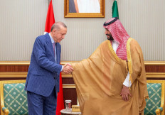 This handout image released by the Saudi press Agency (SPA) on April 29, 2022 shows Turkish President Tayyip Erdogan (left) shaking hands with Saudi Crown Prince Mohammed bin Salman (right) during a meeting in Saudi Arabia's Red Sea coastal city of Jeddah. Erdogan has met with Saudi Arabia's crown prince to 