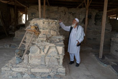 In this photograph taken on May 17, 2022, historical monuments department manager Jalat Surkhabi shows a structure uncovered at an archaeological site in Mes Aynak, in the eastern province of Logar. An ancient Buddhist city carved out of immense peaks near Kabul is in danger of disappearing forever, swallowed up by a Chinese consortium exploiting one of the world's largest copper deposits. Located at the confluence of Hellenistic and Indian cultures, Mes Aynak -- believed to be between 1,000 and 2,000 years old -- was once a vast city organised around the extraction and trade of copper.

