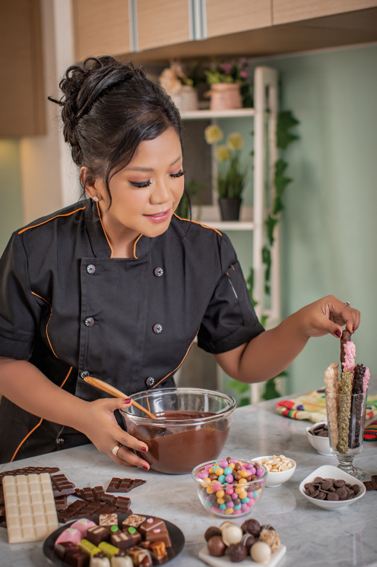 Baking time: Ermey Trisniarty makes a cake. (Courtesy of Dapur Cokelat)