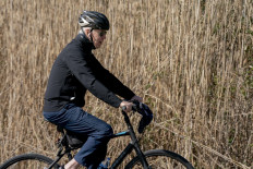 US President Joe Biden rides his bike through Cape Henlopen State Park in Rehoboth Beach, Delaware, on March 20, 2022.
