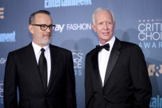 Actor Tom Hanks (L) and retired pilot Chesley Burnett 'Sully' Sullenberger III attend The 22nd Annual Critics' Choice Awards at Barker Hangar on December 11, 2016 in Santa Monica, California. Christopher Polk/Getty Images for The Critics' Choice Awards