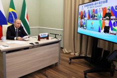 Russian President Vladimir Putin takes part in the XIV BRICS summit in virtual format via a video call, in Moscow, on June 23, 2022. 