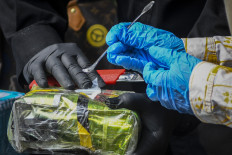 Officers of the National Narcotics Agency (BNN) conducted a laboratory test on narcotics before the destruction at their office in Jakarta on 9 June 2022.