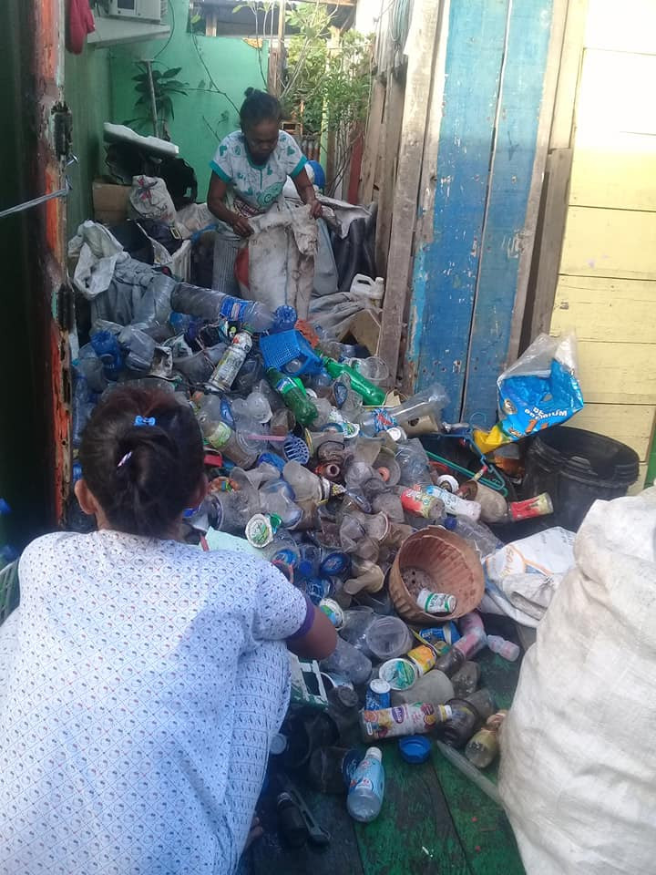 Women empowered: Women at Kampung Nelayan, Belawan, Medan, sorted plastic trash before sending them to the waste bank.  (Courtesy of Hujrah)