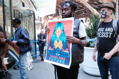 Youth climate activists hold a demonstration outside the building where JPMorgan Chase was holding their annual shareholders meeting on May 17, 2022 in New York City. The group was protesting the global financial institution's funding of fossil fuel.