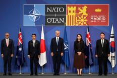 (From left) Australia's Prime Minister Anthony Albanese, Japan's Prime Minister Fumio Kishida, NATO Secretary General Jens Stoltenberg, New Zealand Prime Minister Jacinda Ardern and South Korea's President Yoon Suk-yeol pose for a group photograph ahead of a Indo-Pacific Partners meeting during the NATO summit at the Ifema congress centre in Madrid, on June 29, 2022.
