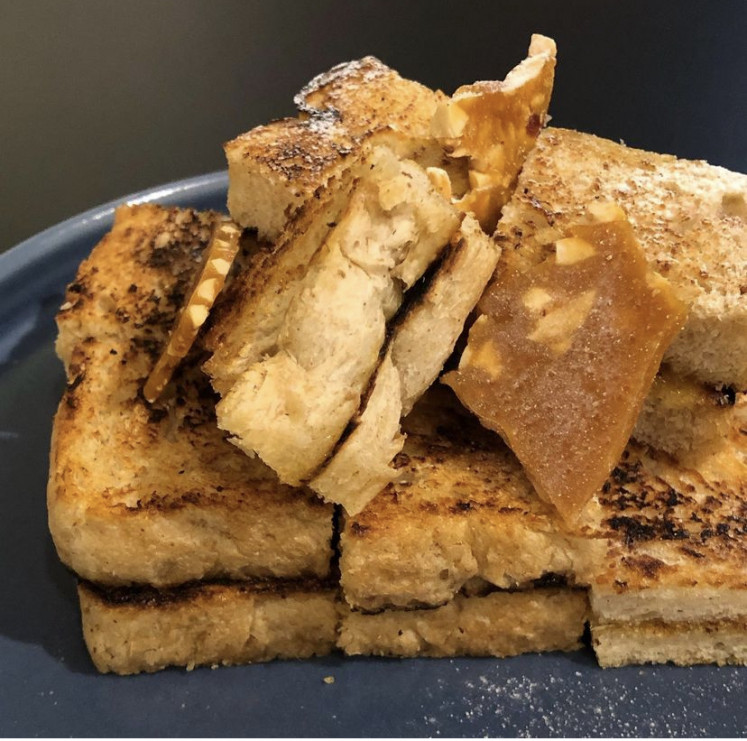 Mouthwatering: Pictured is a plate of Kopitiam-style toast with praline at Seroja Bake. 