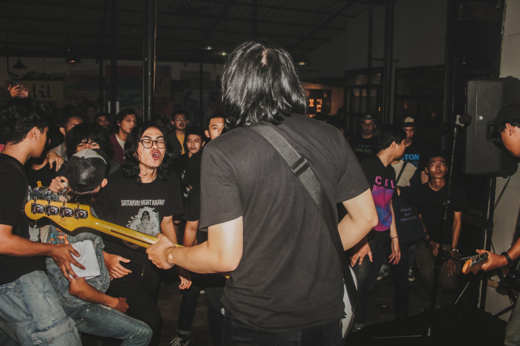On stage: Pictured is bassist Andresa Nugraha facing the crowd when Saturday Night Karaoke perfomed at Wild Generation, a collective event in Bogor, West Java, on June 19. (Courtesy of Ibrahim Partogi)