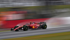 Ferrari's Spanish driver Carlos Sainz Jr drives in rain during the second qualifying session for the Formula One British Grand Prix at the Silverstone motor racing circuit in Silverstone, central England on July 2, 2022.  
