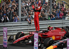 Race winner Ferrari's Spanish driver Carlos Sainz Jr celebrates after the Formula One British Grand Prix at the Silverstone motor racing circuit in Silverstone, central England on July 3, 2022. 