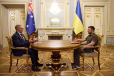 This handout picture taken and released by the Ukrainian presidential press service on July 3, 2022, shows Ukrainian President Volodymyr Zelensky (R) speaking with Australia's Prime Minister Anthony Albanese prior to their meeting in Kyiv. 
