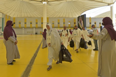 Muslim pilgrims arrive at King Abdulaziz International Airport in Saudi Arabia's Red Sea coastal city of Jeddah on June 5, 2022, prior to the annual Haj pilgrimage in the holy city of Mecca. Saudi Arabia welcomed its first batch of hajj pilgrims since before the coronavirus pandemic, which prompted authorities to sharply restrict the annual ritual.