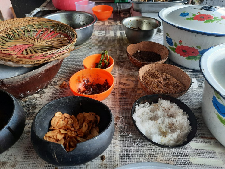 Earthy delights: The lawar spice rack. From ground coriander seeds, spiced chili oil to green peppercorns, lawar is a deeply complex and nuanced dish (JP/Raka Ibrahim)