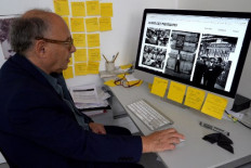 Photographer Howard Grey shows photographs on a computer in London on July 1, 2022. On the day the Windrush migrants arrived, a young London photographer named Howard Grey had an idea. Taking a break from his job photographing ladies' corsets, he decided to chance his hand at a bit of reportage. Today, a search has been launched to identify the young couple and others who arrived that day in 1962. Britain's National Railway Museum in York, northern England, has acquired some of the photographs and is seeking to put names to the faces and tell their stories.
