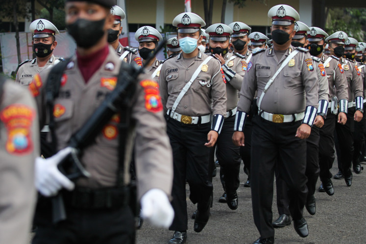 East Java Police personnel attend the 76th anniversary of the National Police on Jul. 5, 2022, in Surabaya, East Java.