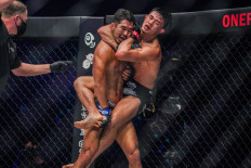 Ok Rae Yoon (center) and Christian Lee (right) engage in a highly contested match in September 2021. The two MMA stars will have a rematch to headline ONE 160 on Aug. 26.