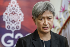 Australian Foreign Minister Penny Wong gives a statement to the media as she arrives to attend the G20 Foreign Minister Meeting at Ngurah Rai International Airport in Bali on July 7, 2022. 
