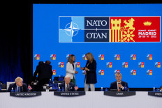 British Prime Minister Boris Johnson, United States President Joe Biden and NATO Secretary-General Jens Stoltenberg attend the round table of a NATO summit in Madrid, Spain June 30.