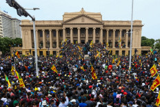 Protestors participate in an anti-government demonstration outside the President's office in Colombo on July 9, 2022. Sri Lanka's beleaguered President Gotabaya Rajapaksa fled his official residence in Colombo, a top defence source told AFP, before protesters gathered to demand his resignation stormed the compound.

