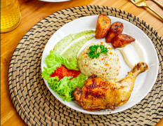 A hearty meal: A portion of African chicken is accompanied by buttered rice at Paris di Jakarta. (Courtesy of Paris di Jakarta)