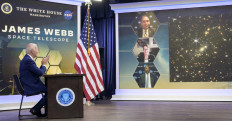In this NASA handout image US President Joe Biden previews the first full-color image from NASA’s James Webb Space Telescope, the highest-resolution image of the infrared universe in history, on July 11, 2022, in the South Court Auditorium in the Eisenhower Executive Office Building on the White House complex in Washington. 