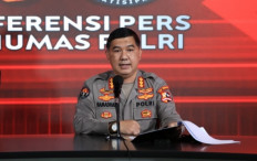 Police spokesperson Brig. Gen. Ahmad Ramadhan speaks to reporters during a press conference at National Police headquarters in Jakarta, in this handout photo dated April 19, 2021.