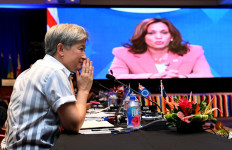 Australian minister for foreign affairs Penny Wong (left) listens to US Vice-President Kamala Harris speaking via video-link to the Pacific Islands Forum (PIF) in Suva on July 13, 2022. 
