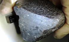 This photograph obtained January 3, 2013 courtesy of NASA shows a fist-sized meteorite nicknamed 