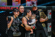 .Angela Lee celebrates with her family after defending her title against Stamp Fairtex at ONE X in March.