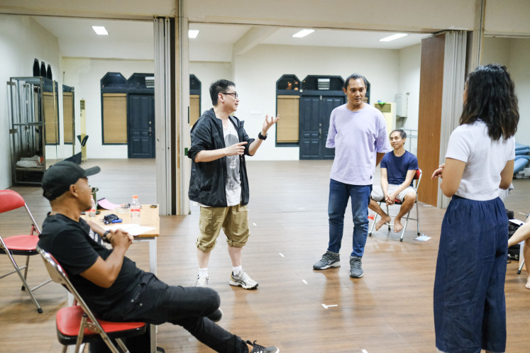 Prior to the show: Rusdy Rukmarata (left) directs the practice of 'Ken Dedes' with Josh Marcy (center) and Ara Ajisiwi (right). (Courtesy of EKI Dance Company) 