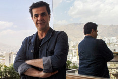 The filmmaker: Iranian film director Jafar Panahi on a balcony overlooking Tehran during an interview on Aug. 30, 2010. Panahi is the third filmmaker reported to have been detained by Iranian authorities in the space of a few days.