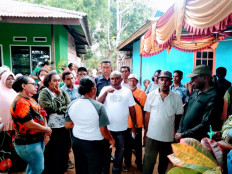 Papua’s Merauke Regent Romanus Mbaraka (center, facing camera in white shirt) meets with residents of Kampung Bati in Samkai subdistrict, Merauke regency, Papua, on Feb. 2. 