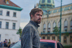 Gray area: Actor Ryan Gosling plays the nameless assassin known as Six who works under the CIA's Sierra program in 'The Gray Man'. (Netflix/Courtesy of Stanislav Honzik)