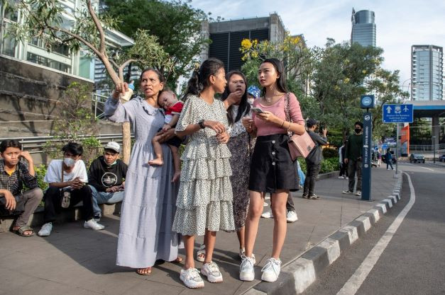 Young people gather near Dukuh Atas MRT station in Central Jakarta in July 2022.