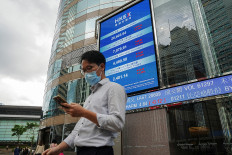 Hong Kong stocks at 11-year low as China sticks to zero-COVID plan