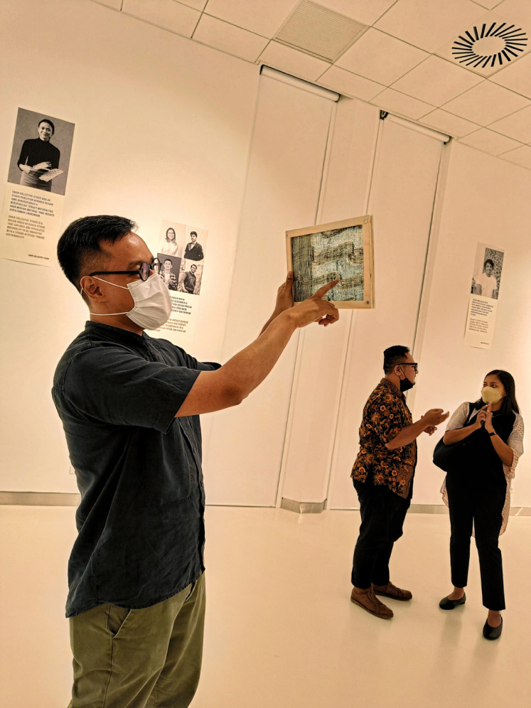 Degradable: Mohamad Taufaniari (left), founder and chief designer of ROA, holds up a panel made of 