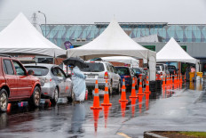 Motorists queue at the Otara testing station after a positive COVID-19 coronavirus case was reported in the community as the city enters a level 3 lockdown in Auckland on February 15, 2021. 
