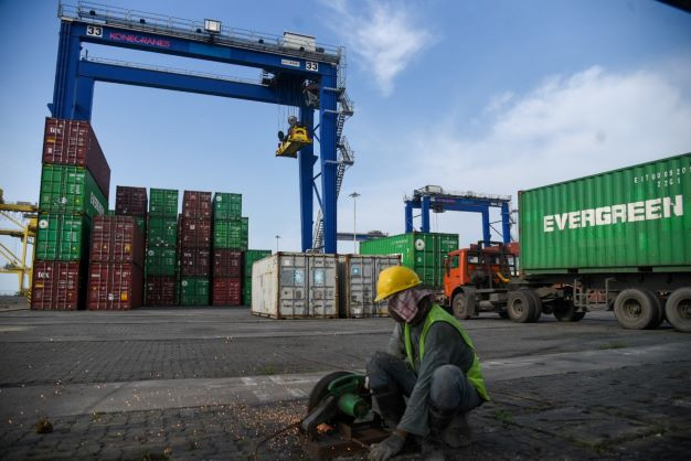 Go international: A worker cuts an iron bar on July 15, 2022 at Belawan International Container Terminal in Medan, North Sumatra. Belawan Port handles both export and import activities.