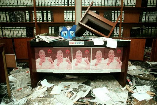 Posters featuring ousted Indonesian Democracy Party (PDI) leader Megawati Soekarnoputri adorn a desk on July 31, 1996, in the sacked PDI headquarters. 