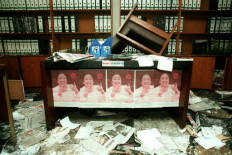 Posters featuring then-ousted Indonesian Democracy Party (PDI) leader Megawati Soekarnoputri still adorn a desk in the sacked PDI headquarters on July 31, 1996. The sacking of the headquarters provoked mass riots that led to 22 buildings being burned down in central Jakarta, prompting a strong military response.