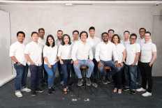 Staff of 99 Group Indonesia pose for a group picture in this undated photo.