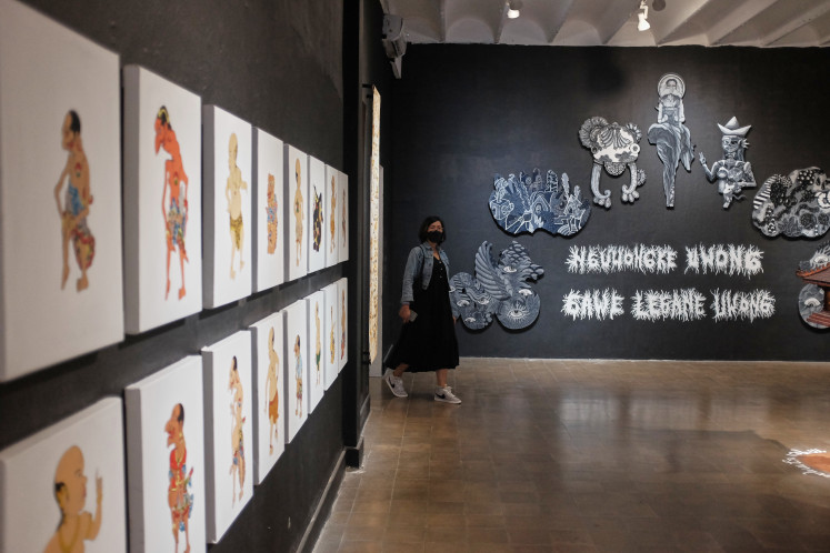 A visitor glances at the Jogja Disability Arts installation work titled 'Babad Disabilitas' at the 2022 ARTJOG Festival. (Courtesy of ARTJOG Festival)