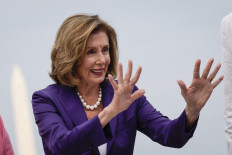 Speaker of the House Nancy Pelosi (D-CA) reacts after signing the CHIPS For America Act during a bill enrollment ceremony outside the US Capitol July 29, 2022 in Washington, DC.  (AFP/Drew Angerer/Getty Images).
Usage: 0