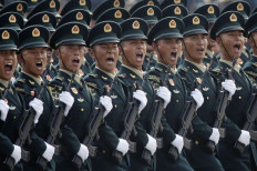Soldiers of People's Liberation Army (PLA) march in formation past Tiananmen Square during the military parade marking the 70th founding anniversary of People's Republic of China in Beijing, Oct. 1, 2019.