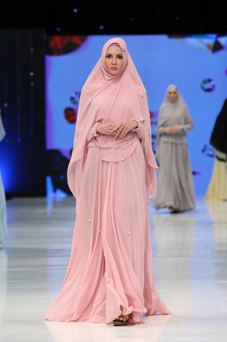 Creative start: A model displays a flowing pink outfit from Si.Se.Sa's 'Flori' collection on June 17, 2016 during the brand's annual fashion show at Da Vinci Tower in Tanah Abang, central Jakarta .  (Courtesy of Tim Muara Bagdja)