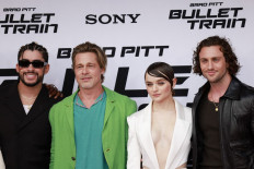 In this file photo taken on August 01, 2022, (left-right) Puerto Rican rapper-actor Bad Bunny, US actor Brad Pitt, US actress Joey King and English actor Aaron Taylor-Johnson attend the Los Angeles premiere of 