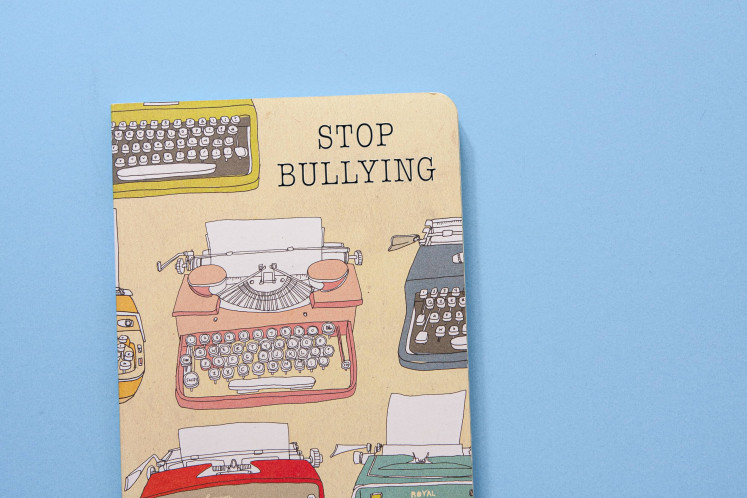 Dire message: Pictured is a book bears a 'Stop Bullying' message on its cover. Ai Maryati Solihah, a commissioner at the KPAI, said bullying only causes 'heartache, someone being hurt, discriminated against, ostracized and humiliated'. (Unsplash/Dee @ Copper and Wild)