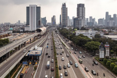 Traffic flows along a Jakarta thoroughfare on July 26, 2022.