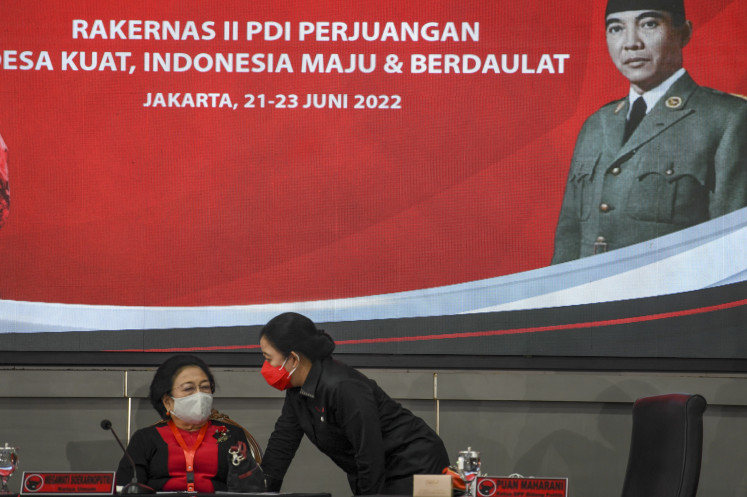 House of Representatives Speaker Puan Maharani (right), who also chairs the central board of the Indonesian Democratic Party of Struggle (PDI-P), speaks to her mother, PDI-P matriarch Megawati Soekarnoputri, during the party’s national working meeting on June 21, 2022 in Jakarta.