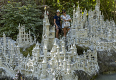 Swiss artist sculpts sprawling model castle on dried river bank